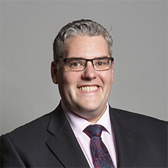 Official portrait of Gavin Robinson
