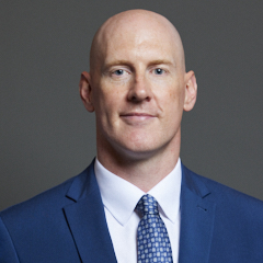 Official portrait of Dr Kieran Mullan