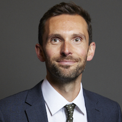 Official portrait of Josh MacAlister