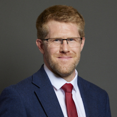 Official portrait of Tom Collins